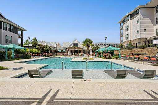 Outdoor Swimming Pool Area   at Palm Crossing Apartments Winter Garden FLat Palm Crossing Apartments Winter Garden FL