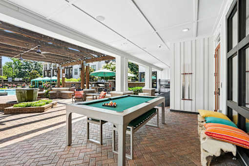Outdoor Pool Table at Palm Crossing Apartments Winter Garden FL