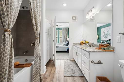 Bathroom with tub  at Palm Crossing Apartments Winter Garden FL