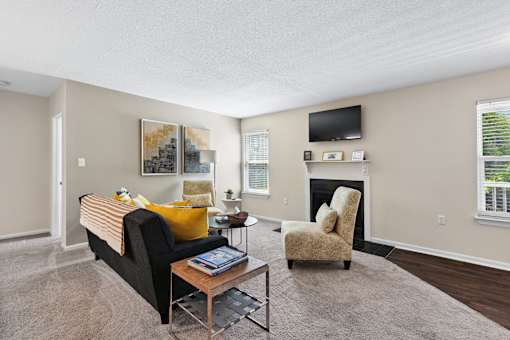 a living room with a couch and a coffee table at Palmetto Place Apartments, Taylors, 29687