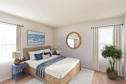 A bedroom with a bed, nightstand, and a plant.