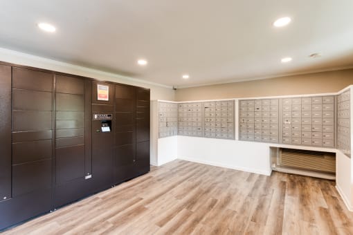a lockers room with wooden floors and white walls