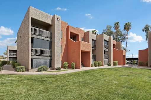 A modern building with a red and beige exterior.