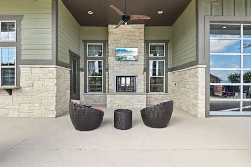 Clubhouse Fireplace Lounge Outside at Overlook at Stone Oak Park Apartments, San Antonio, 78258