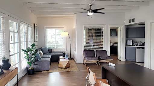 A living room with a grey couch and a brown coffee table at North Mountain Apartments, Phoenix, AZ, 85020