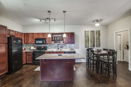 Kitchen with Island (most units come with an kitchen island)  at Overlook at Stone Oak Park Apartments, San Antonio, 78258