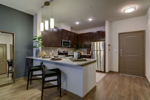 MODEL - Kitchen with Granite Counters & Stainless Steel Appliances