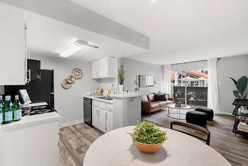 A modern kitchen with a dining table
