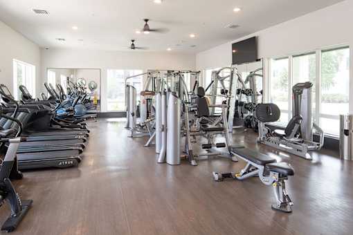Fitness with cardio and weight training machines at Avli At Crosstown Center Apartments, Florida