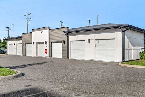 Private garages with individual numbered doors at Avli At Crosstown Center Apartments, TAMPA, Florida
