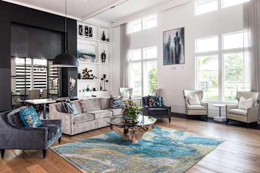 Living room with high ceilings and large windows at Avli At Crosstown Center Apartments, TAMPA, 33619