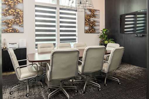 Conference room with oval table and leather chairs at Avli At Crosstown Center Apartments, TAMPA, FL 33619