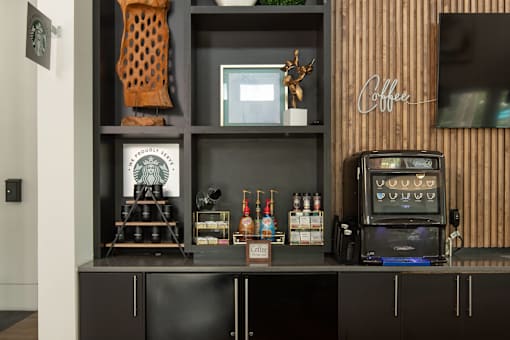 Coffee bar with shelving and espresso machine at Avli At Crosstown Center Apartments, Florida, 33619