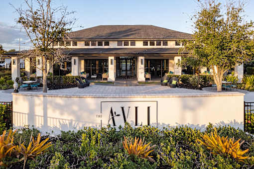 Property entrance monument sign with modern landscaping at Avli At Crosstown Center Apartments, TAMPA, FL