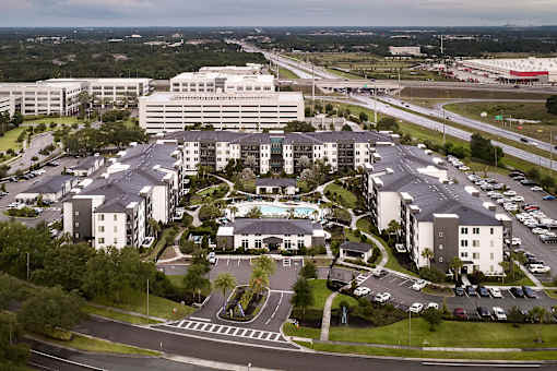 Aerial view of residential community with highway access at Avli At Crosstown Center Apartments, TAMPA, FL