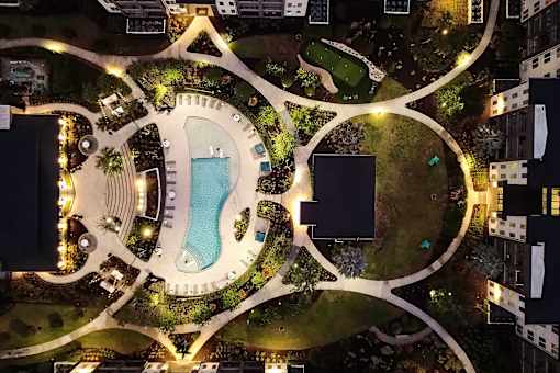 Aerial view of resort pool and courtyard amenities at Avli At Crosstown Center Apartments, TAMPA, Florida
