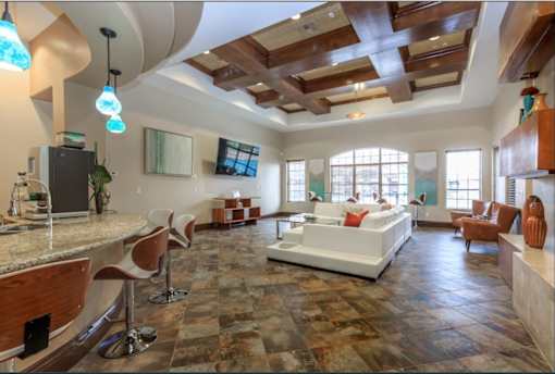 a large clubhouse with a couch and a table