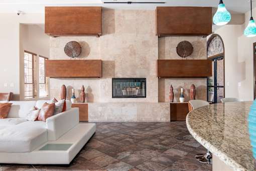 A living room with a fireplace and a couch.