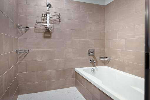 Bathroom with bathtub at Pointe at Lake Crabtree Apartments, Morrisville, North Carolina