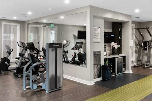 Gym with cardio equipment at Pointe at Lake Crabtree Apartments, Morrisville, North Carolina