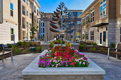Planter with flowers at Pointe at Lake Crabtree Apartments, North Carolina