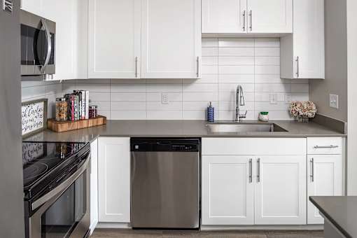 White kitchen at Pointe at Lake Crabtree Apartments, Morrisville, 27560