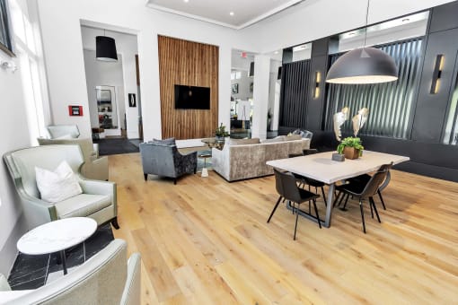 a living room filled with furniture and a large window