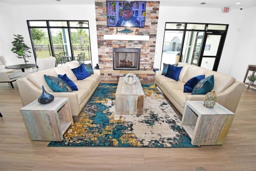 a living room filled with furniture and a fireplace