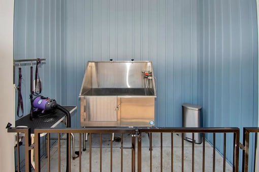 a small refrigerator is in the corner of a room