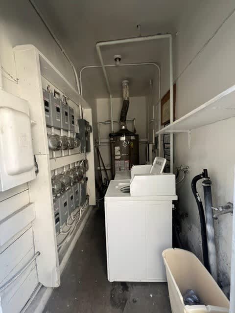 A white bathroom with a toilet and sink.