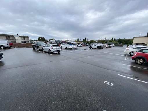 A parking lot with cars parked in it.