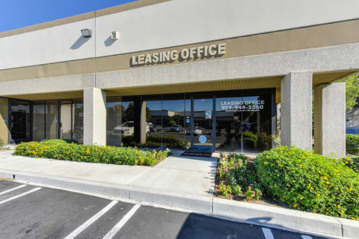 Arrow Business Center leasing office building with many windows and glass window door. 