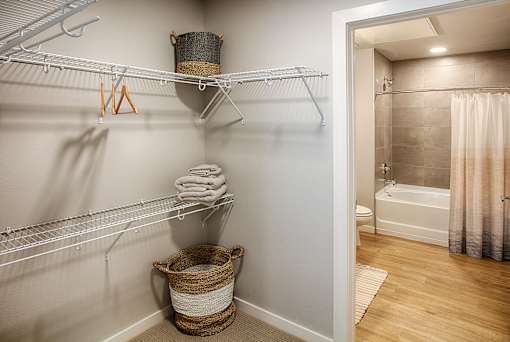 A bathroom with a white towel hanging on a rack.