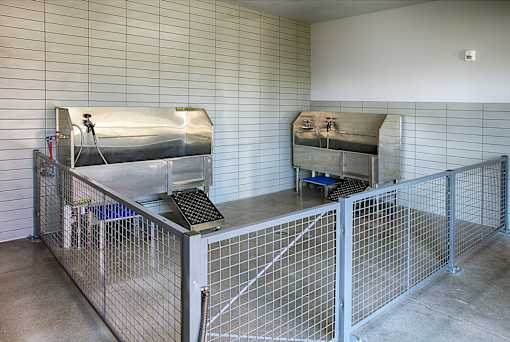 A room with a metal fence and a machine on top of it.