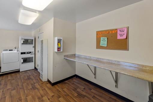 A kitchen with a white fridge and a white oven.