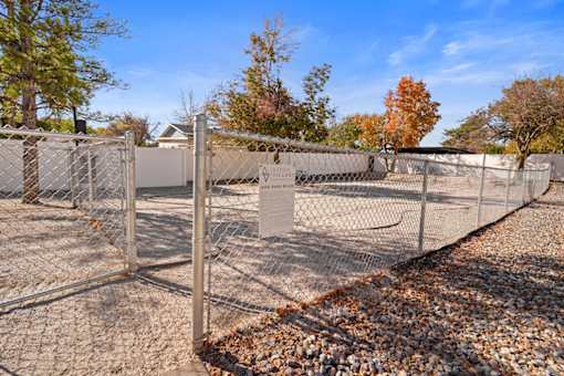 a chain link fence with a sign on the gate