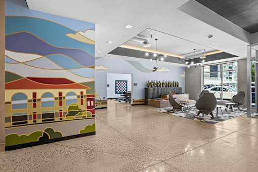 A large mural of a train on a wall in a waiting area.