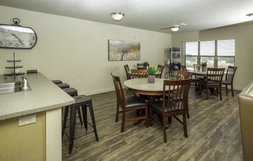 a resident clubhouse with a kitchen and dining area