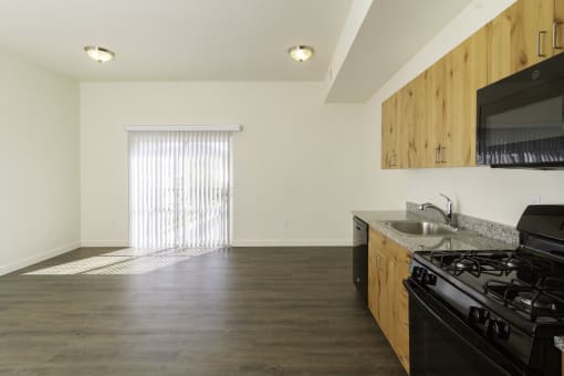 a kitchen and living room in an apartment