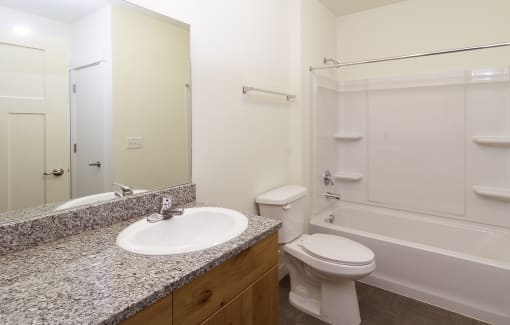 a bathroom with a sink toilet and bathtub