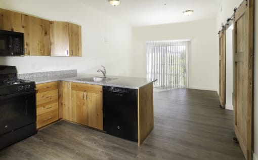 a kitchen and living room in a 555 waverly unit