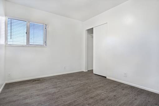 A room with a window and a door.