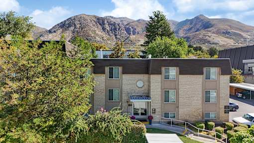 A building with a mountain in the background.
