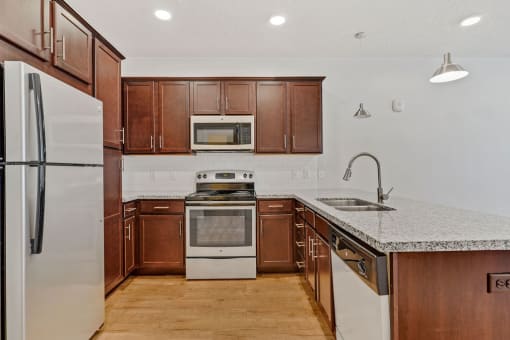 a kitchen with wooden cabinets and a counter top