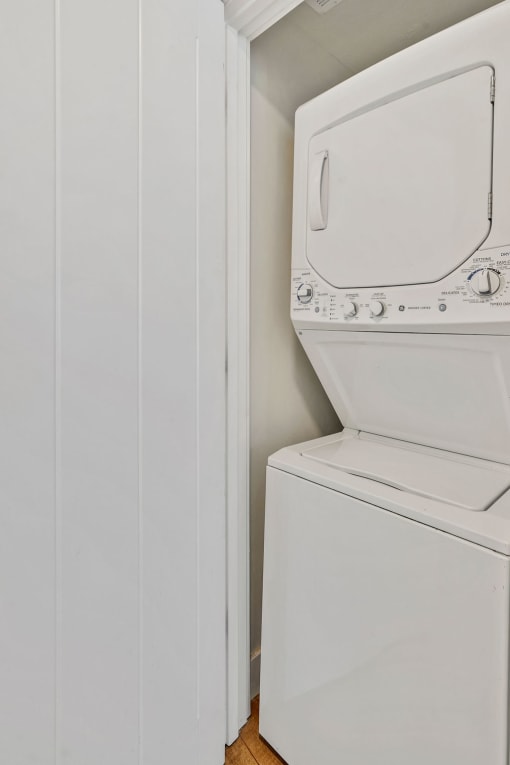 a small laundry room with a washer and dryer in it