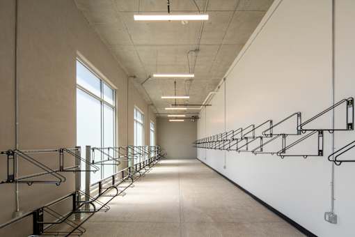 A long hallway with a series of stairs on the right side.