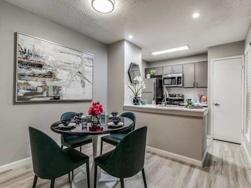 Modern kitchen with dining area at The Melville Apartments