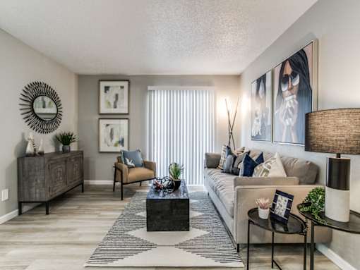 Open-concept apartment living room with modern finishes at The Melville Apartments