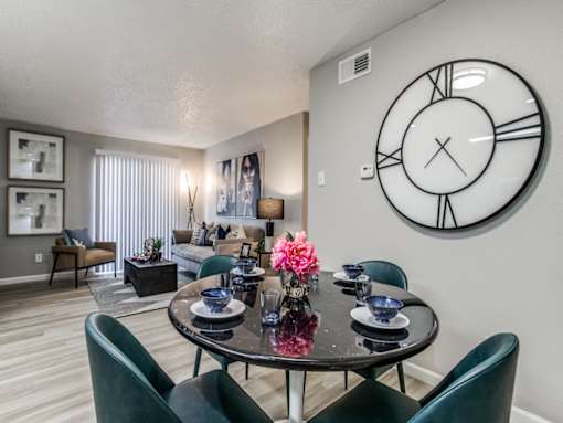 Dining area in a modern apartment home at The Melville Apartmentsor four.