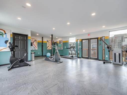 Spacious resident fitness center at The Melville Apartments